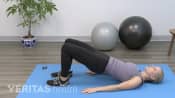 Woman doing a bridge exercise.