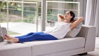 Young Woman Napping on a Sofa