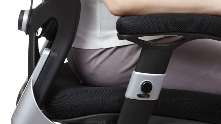 Woman sitting in ergonomic office chair