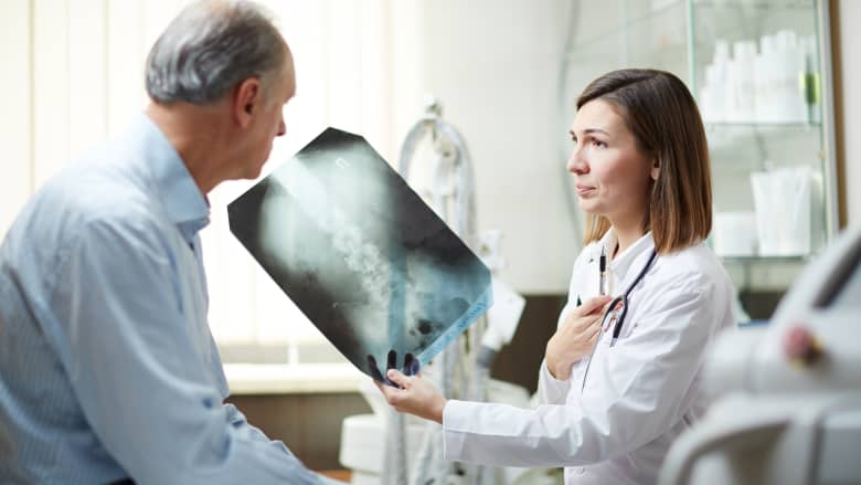 Doctor and patient reviewing the patient's x-ray.