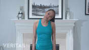 Woman performing the lateral neck extension stretch.