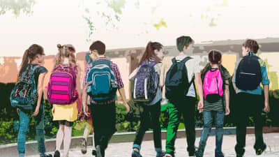 View of seven children walking with backpacks at school.