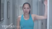 Woman doing the levator scapulae stretch