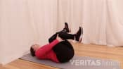 Woman doing a Supine Piriformis Muscle Stretch
