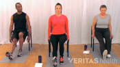 three people performing seated hamstring stretch for sciatica from a herniated disc