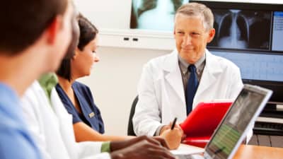 Doctors sitting together to diagnose a disease.