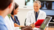 Doctors sitting together to diagnose a disease.