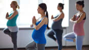 Pregnant women in a yoga class.
