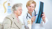 Senior patient reviewing x-ray with a physician