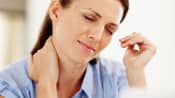 Woman holding her neck in pain