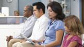 Several patients in a doctors waiting room