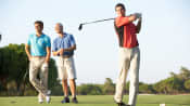 Three men on the golf course