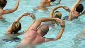 Group doing water aerobics in a pool.