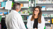 Male customer speaking to a pharmacist