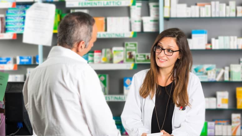 Male customer speaking to a pharmacist
