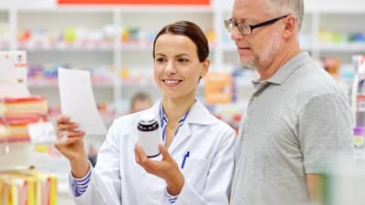 Pharmacist and customer having a consultation.