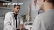 Chiropractor conducting an exam with a patient