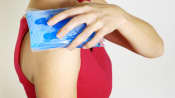 Gel pack icing a woman's shoulder