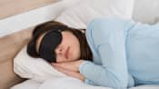 Woman sleeping with sleep mask