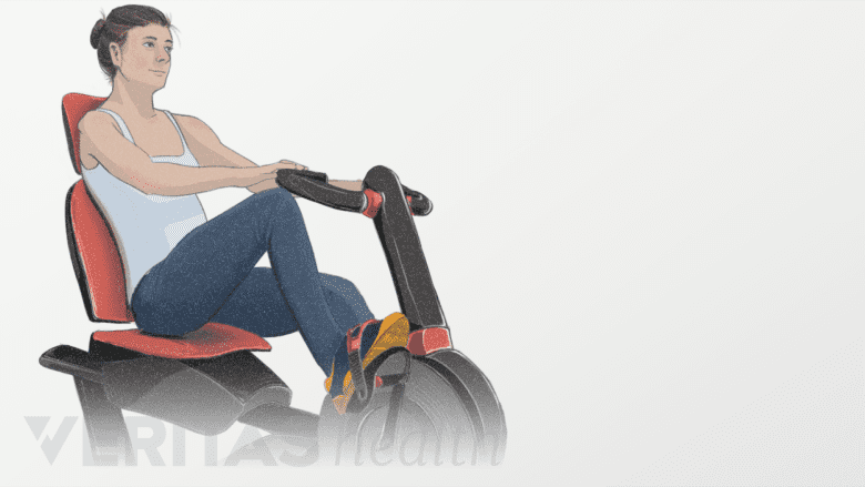 Woman using a stationary bike.