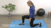Woman doing a kneeling lunge stretch