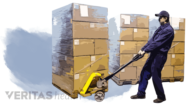 Filtered image of a man pulling a stack of boxes.