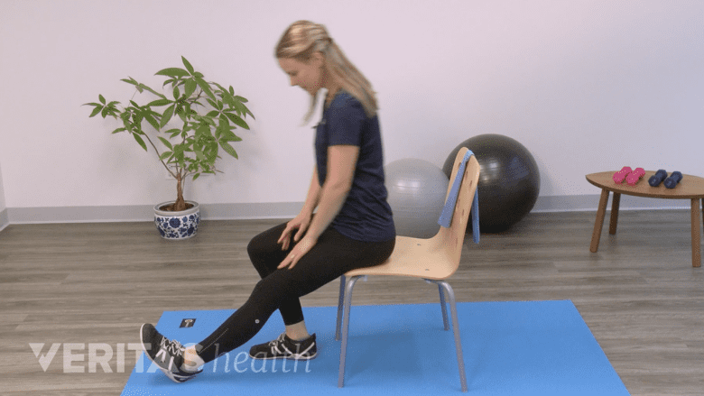 A therapist showing stretching exercise.