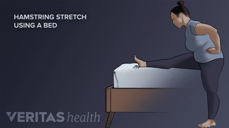 Hamstring stretch performed using bed.