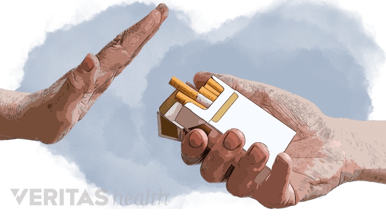 An illustration showing a hand and a pack of cigarette.