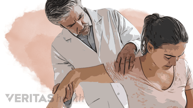 An image showing a doctor evaluating a patient.