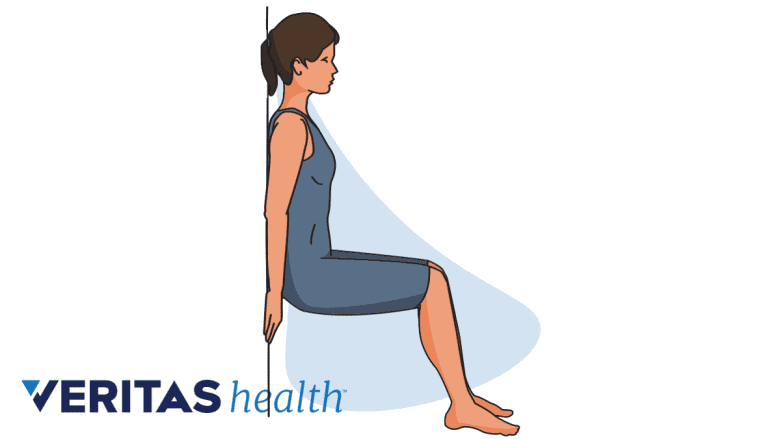 Woman doing wall squats for knee strengthening