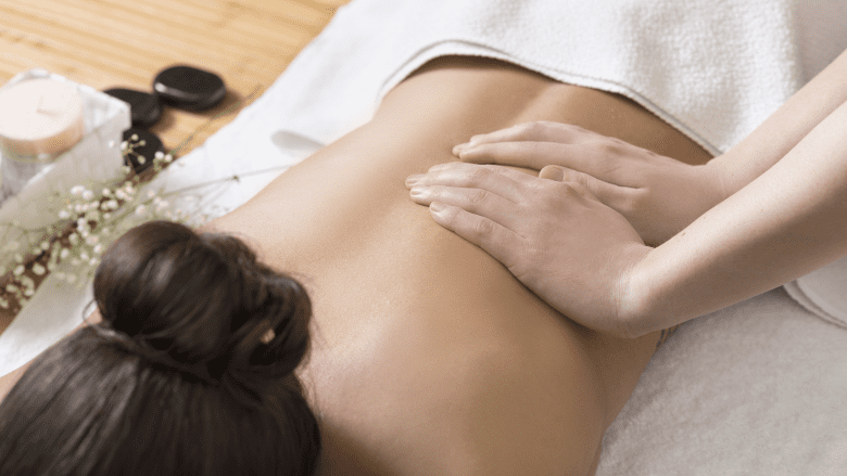 A woman receiving massage therapy.